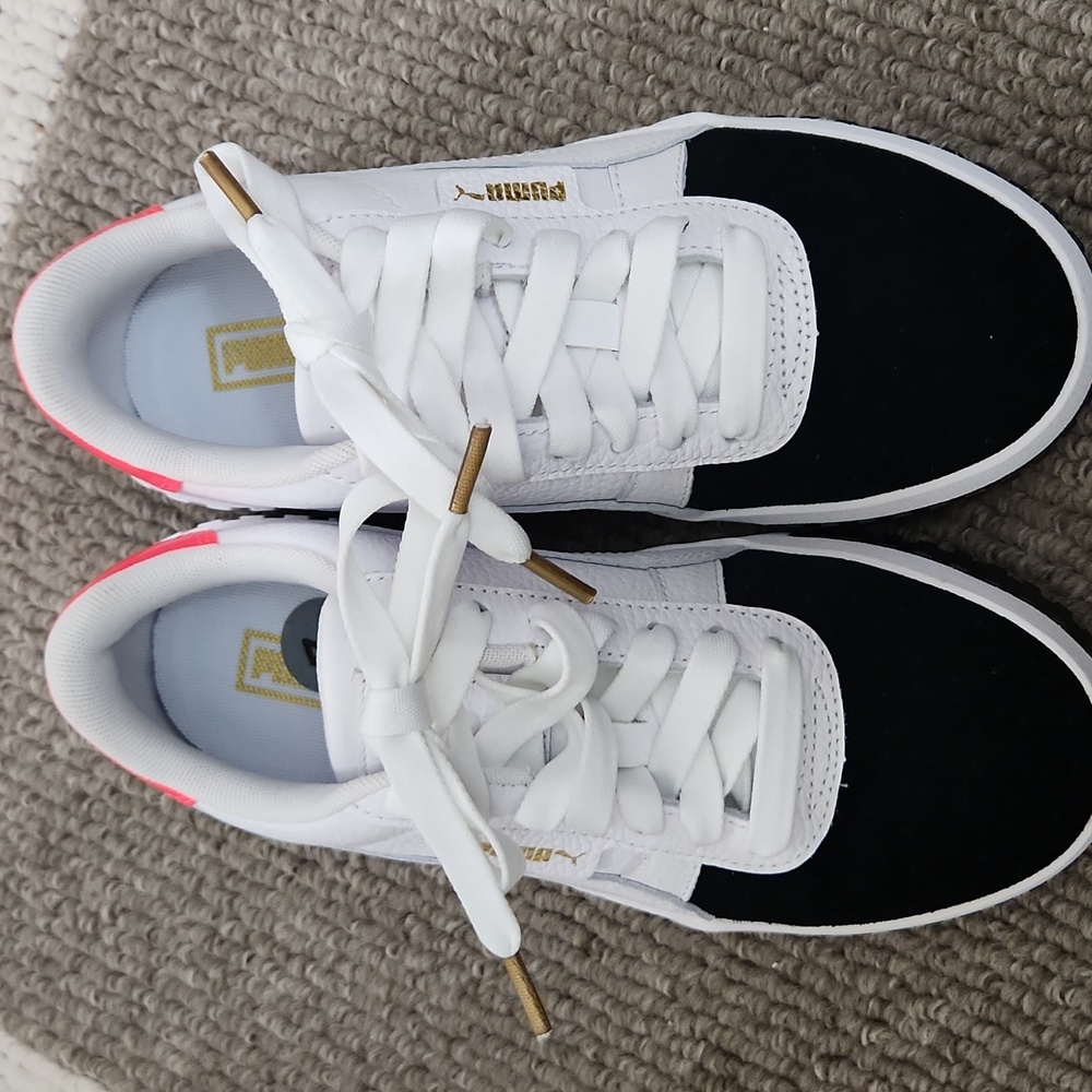 Black white and hot pink Puma sneakers